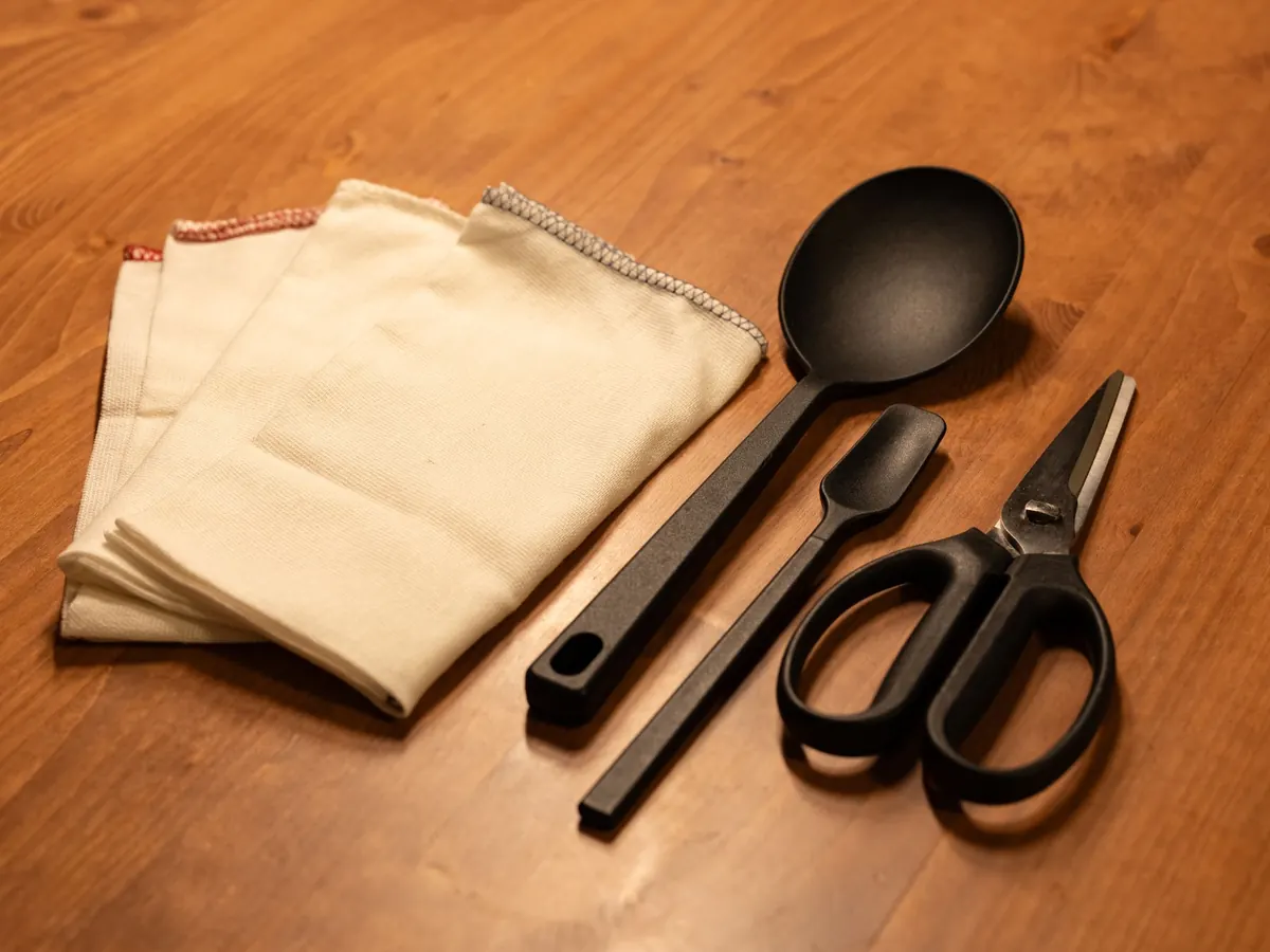 Wooden kitchen utensils laid out on a table